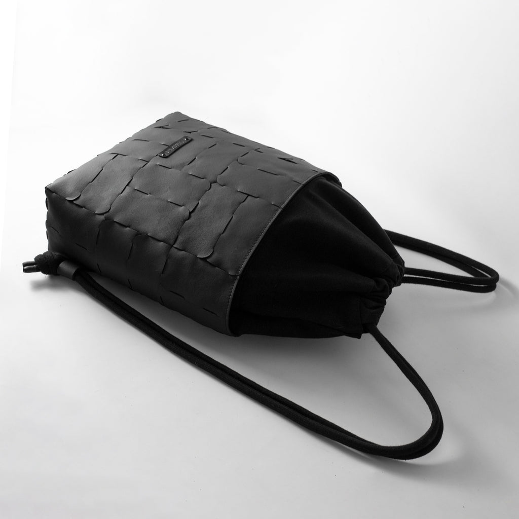 Recycled leather and canvas drawstring backpack