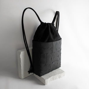 Recycled leather and canvas drawstring backpack